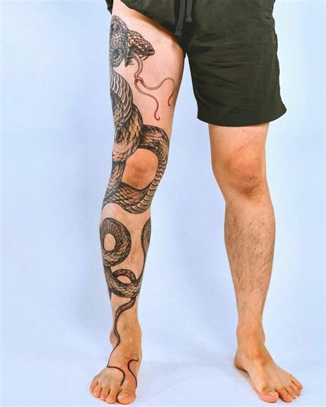 snake wrapped around leg tattoo meaning|70 Snake Tattoo on Leg Designs to Wrap Your Head Around